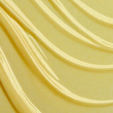 Close-up of smooth, beige-colored fabric with wavy patterns