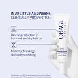 Obagi Medical serum bottle held by a hand with text about hair fall reduction and breakage minimization.