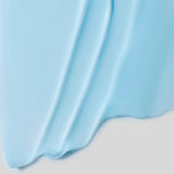 Close-up of light blue fabric with a white background