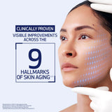 Advertisement for skin care product showing a woman's face with digital lines indicating skin aging, on a light blue background.
