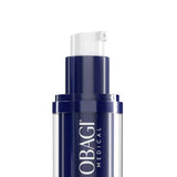 A close-up of an OBAGI MEDICAL skincare pump bottle with a dark navy blue and clear cylindrical body, featuring the brand name in white text and a white pump dispenser on a solid white background.