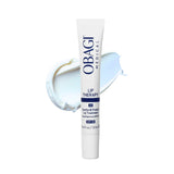 A white tube of Obagi Medical Lip Therapy SPF 30 lip treatment, centered in front of a light blue and white cream smear on a clean white background.