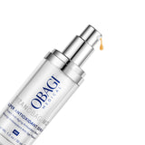 A clear cylindrical pump bottle of Obagi Medical Super Antioxidant Serum with a reflective silver pump, shown on a clean white background with a small amber droplet dripping from the top.