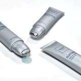 Three tubes of Olay Elastiglow cream on a white background