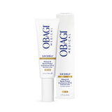 A white tube of Obagi Medical Sun Shield Mineral UV Barrier Protect Broad Spectrum SPF 40 Sunscreen Lotion stands next to its matching white packaging box on a clean white background.